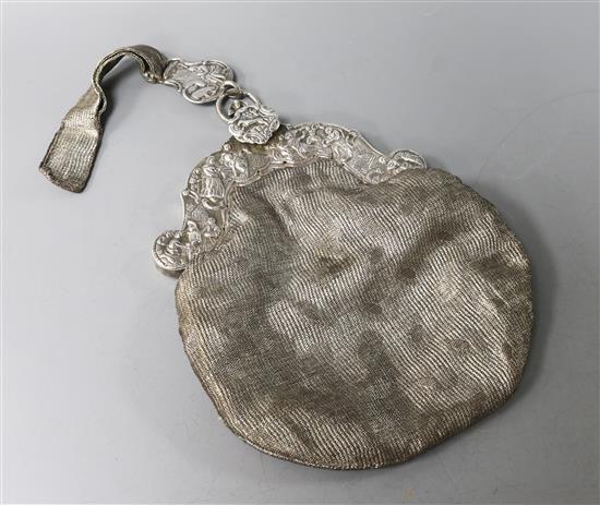 A late 19th century embossed silver mounted evening bag, import marks for London, 1892.